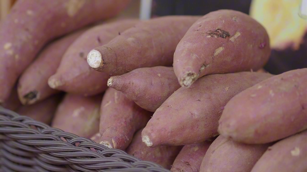 Fresh Sweet Potatoes in a Wicker Basket
