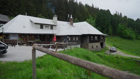 small cabin in the mountains surrounded by trees