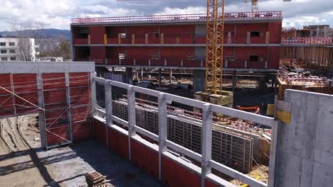 Building-Construction-With-Cranes-Aerial-View