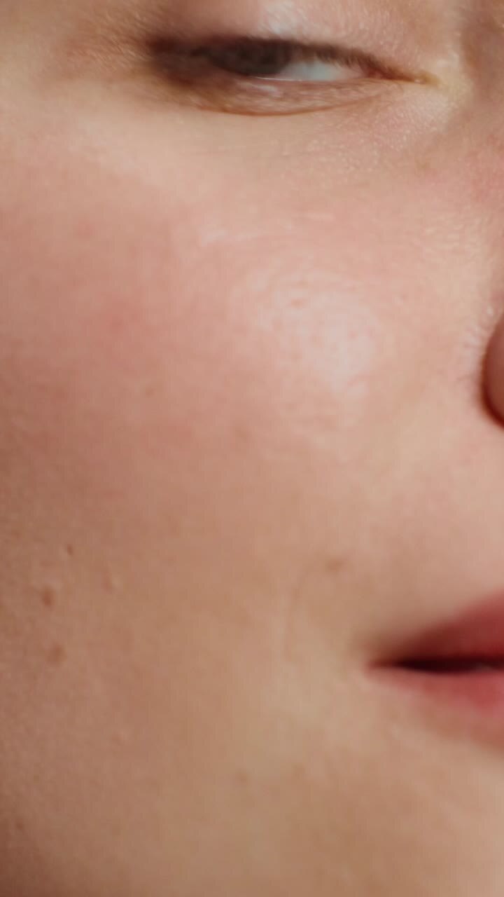 Woman Applying Blush Makeup