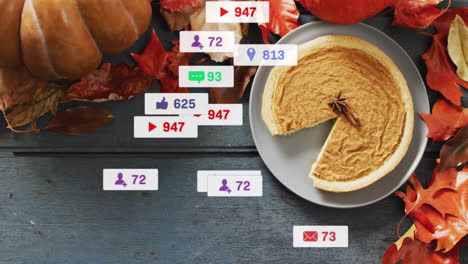 notificaciones de las redes sociales animadas sobre hojas de otoño y pastel de calabaza en una mesa de madera