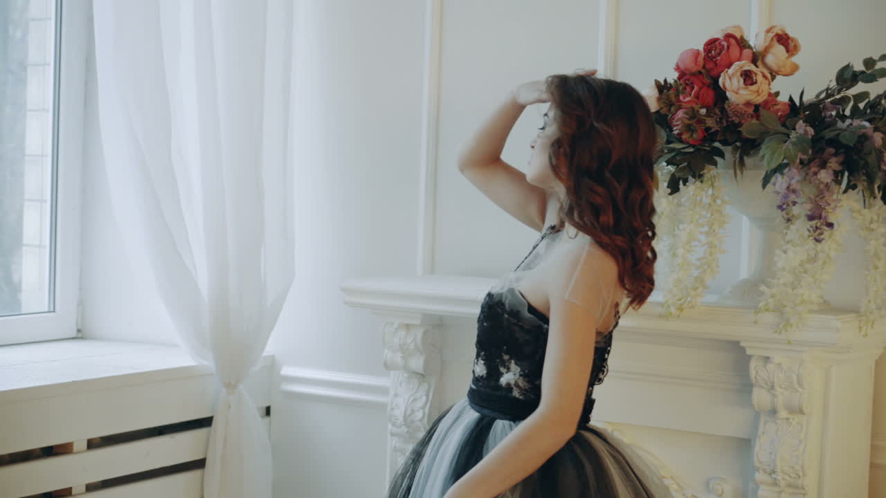 Woman posing in studio. Vogue style model girl in elegant long dress posing in studio