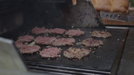 Frying-ground-beef-meat-on-a-grill-together-with-diced-onion