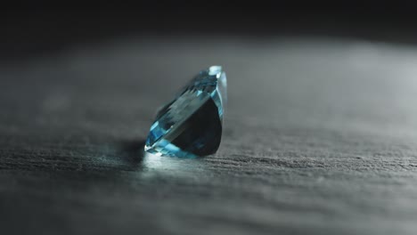 polished blue gemstone rotates and sparkles