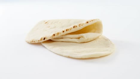 Two-flat-breads-on-white-background