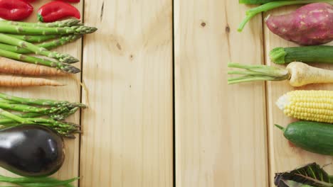 Video-of-fresh-vegetables-with-copy-space-over-wooden-background