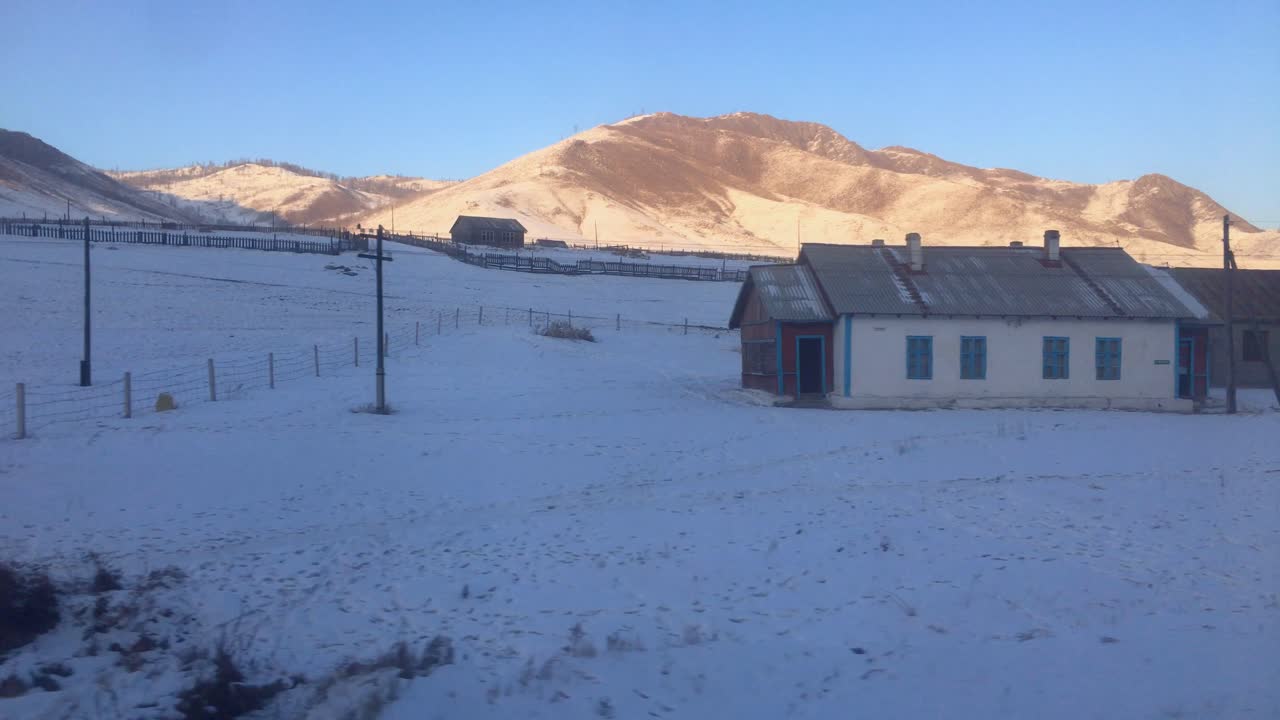 Train Journey Through Rural Mongolia Past Scenic Hillside Village