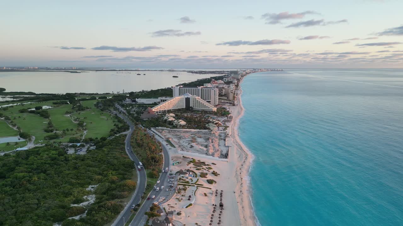 Beautiful aerial view of Cancun's coastline with a hotel and the ocean in the background, playa delfines