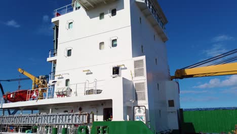 Close-Up-of-General-Cargo-Ship-Docked-Near-Bridge-at-Canal-in-Canada