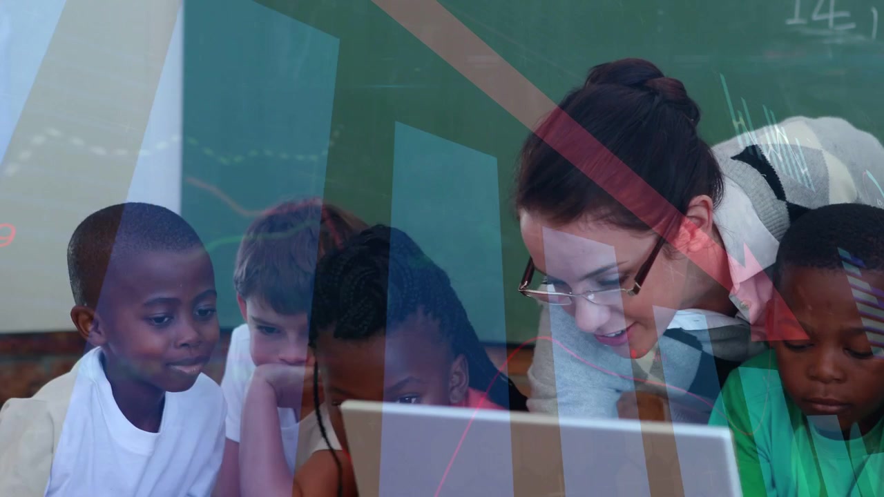 Teacher with school-aged children leaning over laptop in classroom, tugging glasses, guiding lesson