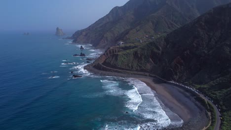 aerial drone video of a black beach