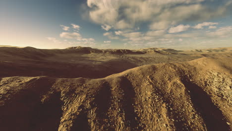 Majestic desert landscape with rolling hills and dramatic skies at sunset
