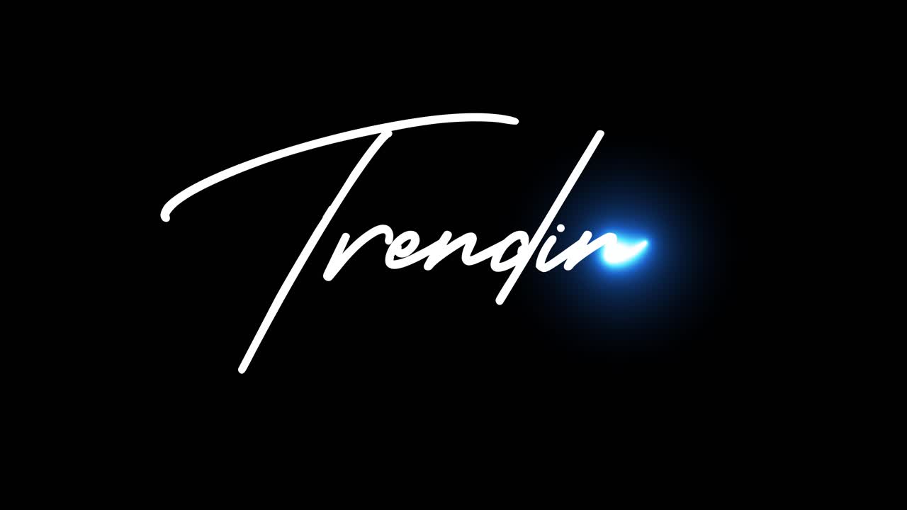 Glowing letter T on black background