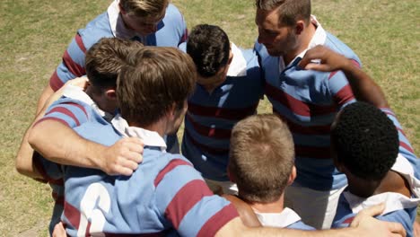 Rugby-players-forming-a-huddle-on-the-field-4K-4k