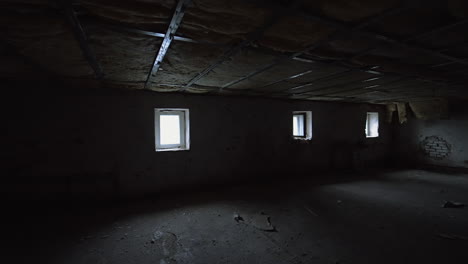 being inside the large dark room with little windows. low angle view on the insulated ceiling of the basement.