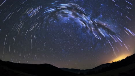 star trails and milky way over mountains