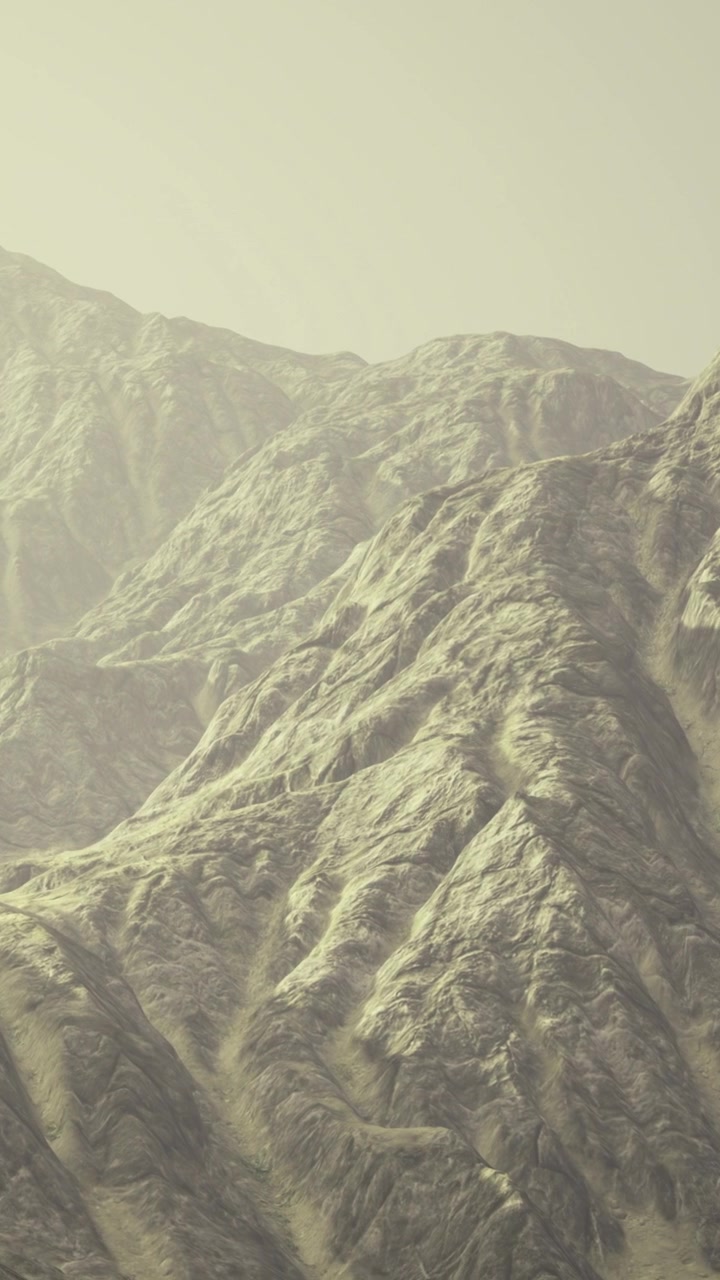 Mountains and rocky terrain under a cloudy sky in a remote location