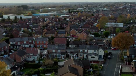 typical british suburban village in merseyside, england aerial view over autumn residential council neighbourhood