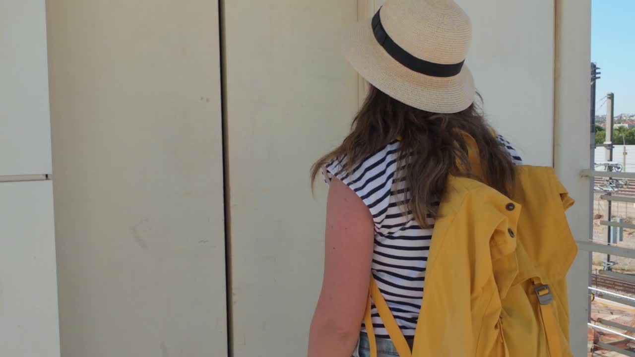 Woman Waiting Calmly for Elevator