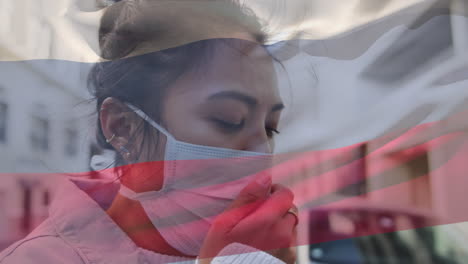 rusia agitando una bandera contra una mujer asiática que usa una máscara para la cara tosendo en la calle