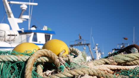 fishing nets and boats at a harbor