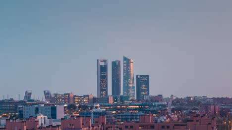 ctba skyscrapers building day to night timelapse of modern city of madrid during colorful sunset with moving clouds city skyline from las tablas viewpoint