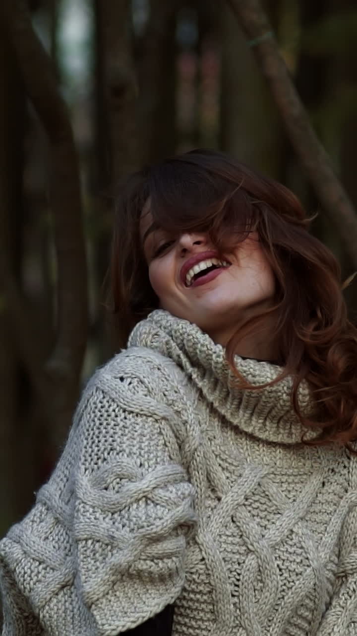 Woman posing in park. Happy young woman posing in autumn park