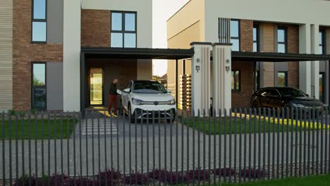 modern houses with cars in driveway