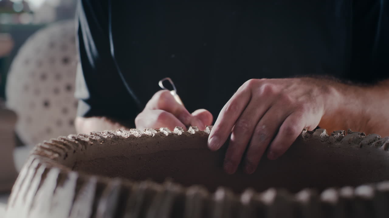 Pottery Artist Working on Clay Sculpture