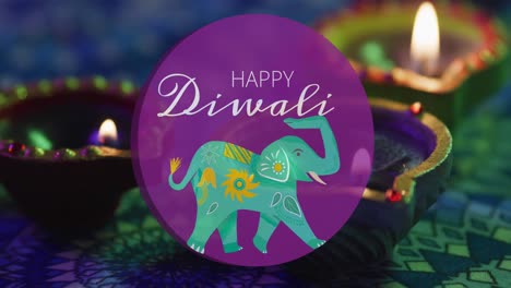 animación del feliz texto de diwali y el elefante azul, sobre las velas encendidas en la mesa