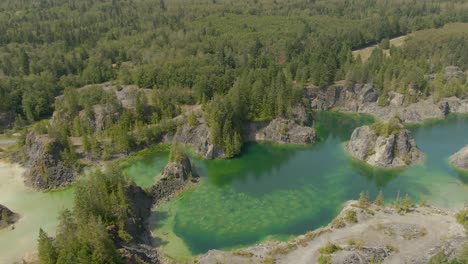 beautiful aerial view of the colorful lakes in the canadian nature during a sunny summer day