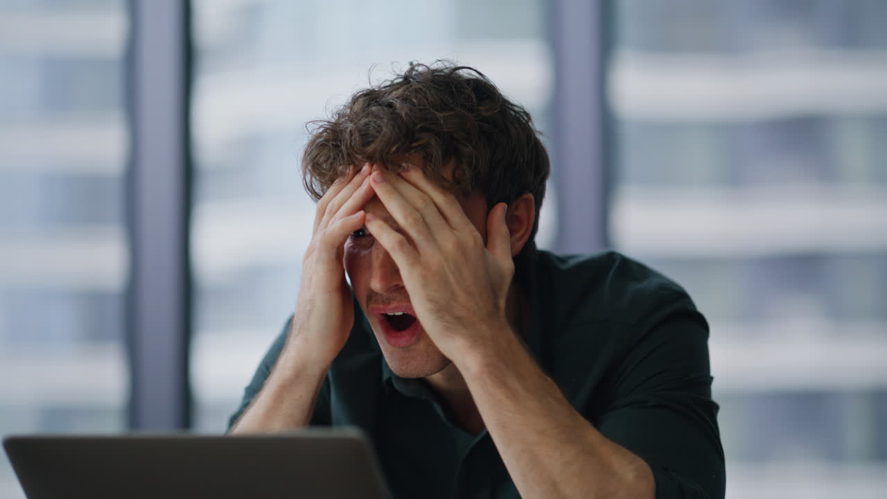 Disappointed entrepreneur closing laptop find mistake sitting office closeup