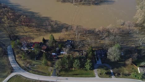 aerial top down view of riverfront homes flooded after heavy rain in kentucky usa