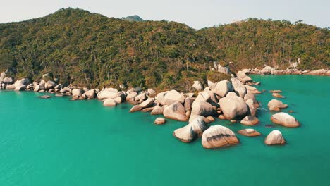 rocky tropical rainforest coastline aerial view with turquoise sea