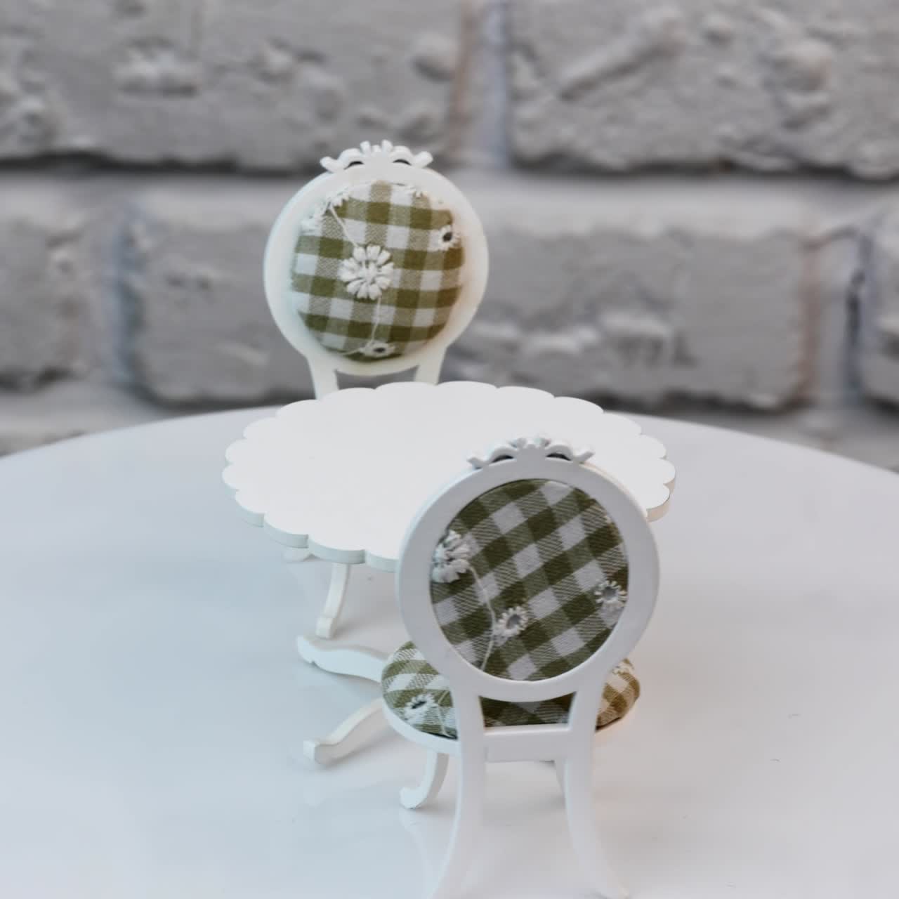 Close up of wooden toy. Toy furniture circling isolated againg wall background