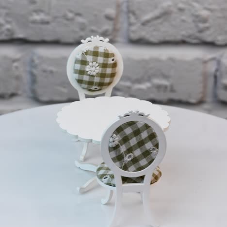 close up of wooden toy. toy furniture circling isolated againg wall background