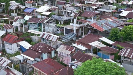 Aerial-flyover-of-Bacuag-Catholic-Cemetery-in-Surigao-Del-Norte,-Philippines