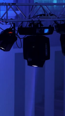 spotlights illuminate the stage at a concert