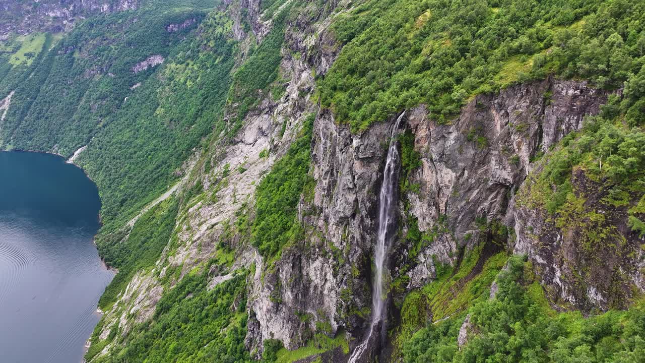Aerial View of Waterfall and Cliff Above Fjord in Landscape of Norway, Geirangerfjord, Drone Shot, Seven Sisters Waterfall
