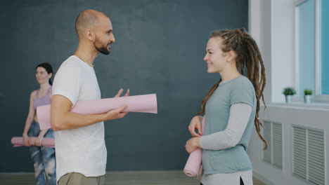 Yoga Instructor and Student Discussing