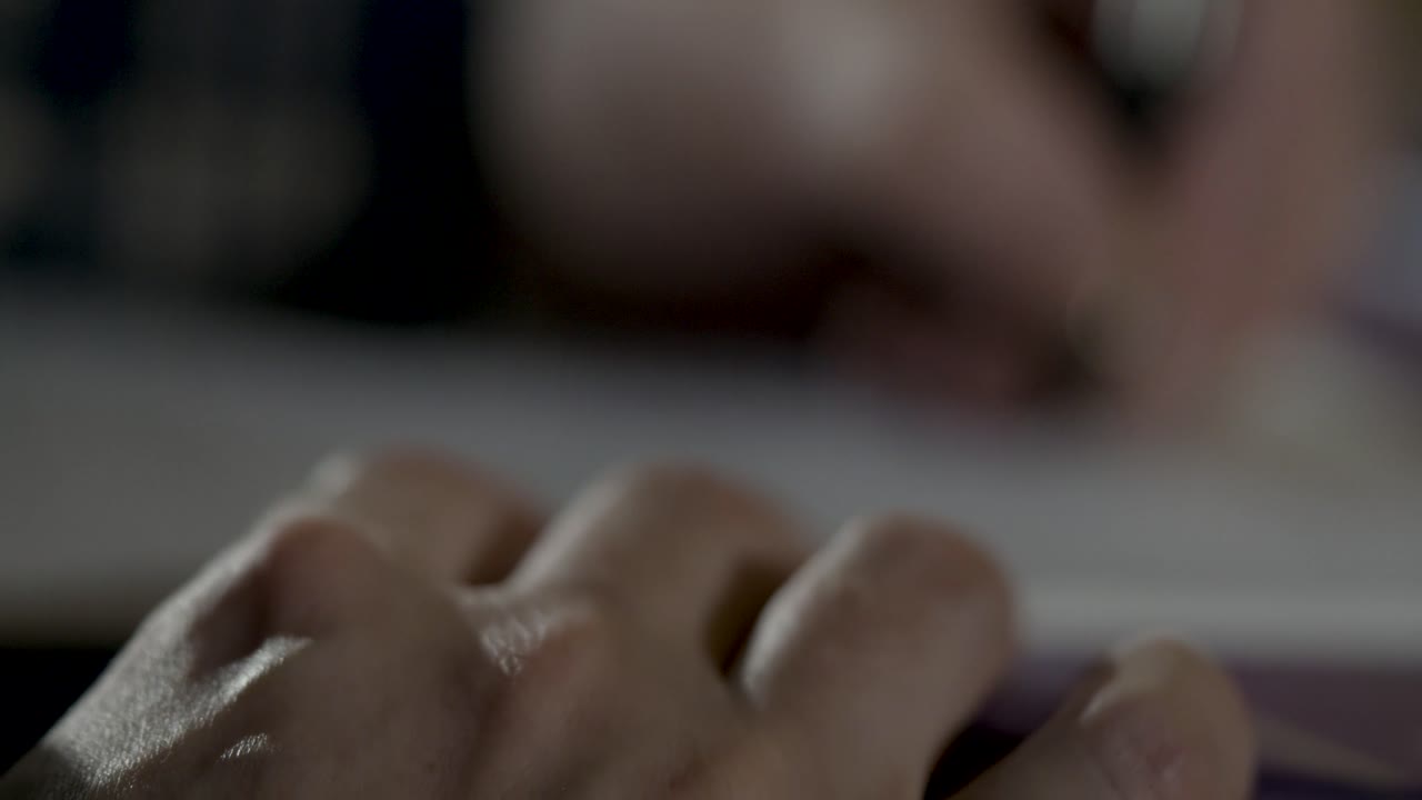 Close-up of a hand drawing on paper with a pen