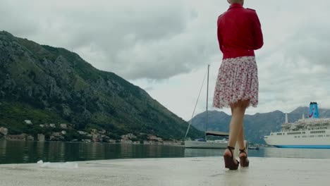 woman looking at the sea view from a port