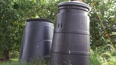 compost bins in a summer garden medium panning shot