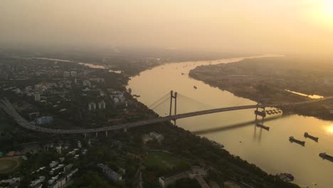 breathtaking sunset view of vidyasagar bridge in kolkata, showcasing its elegance over the serene river.