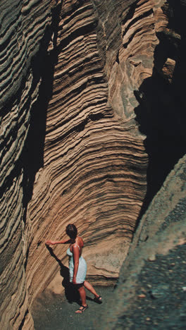 woman exploring a volcanic canyon