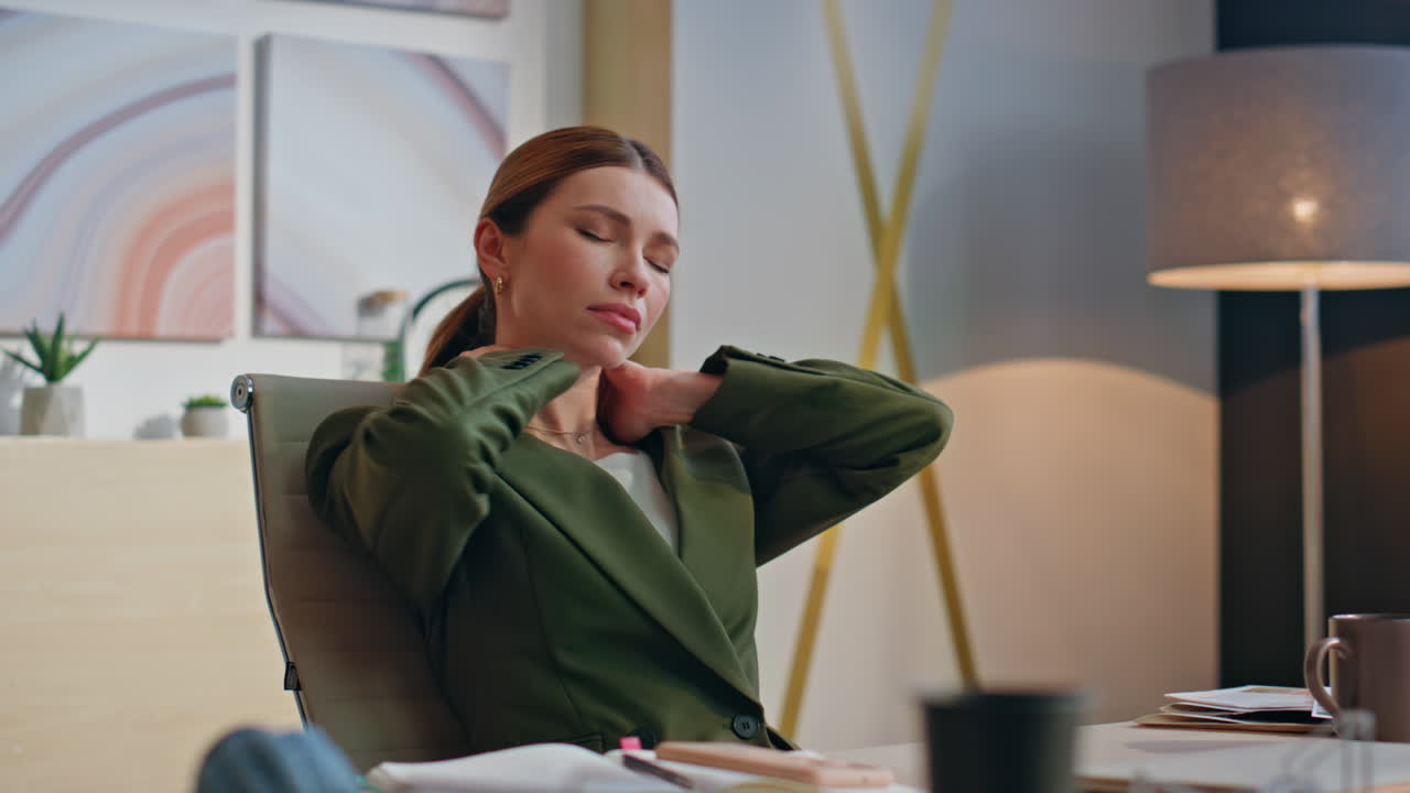 Tired businesswoman massaging neck at laptop workplace closeup. Woman stretching