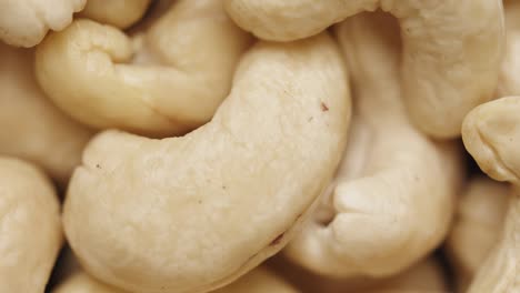 smooth camera movement over a handful of cashew nuts.