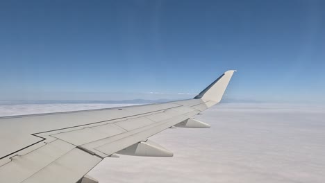 Looking-out-the-window-of-an-airplane---excitement-of-going-on-vacation