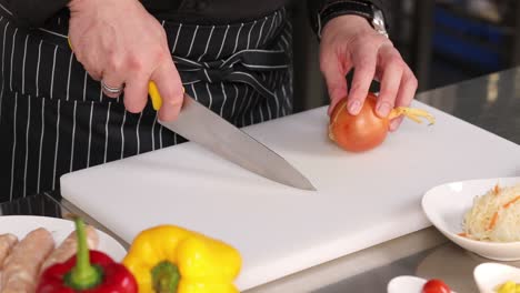 chef chopping onion