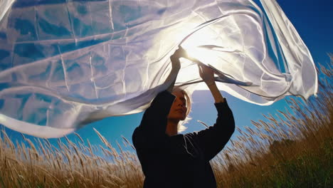 woman with scarf in field